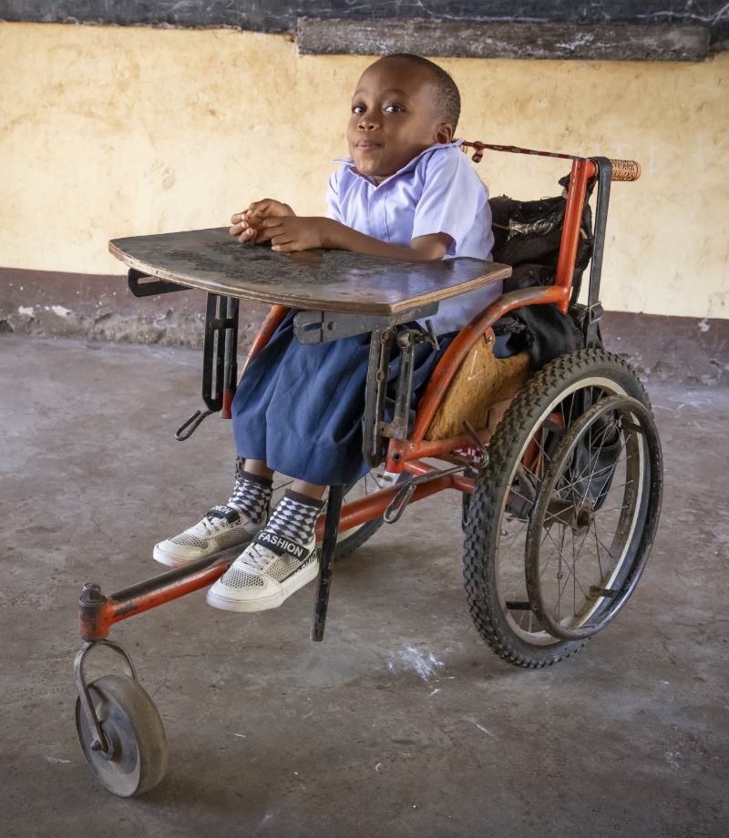 Rose sitting in a worn out wheelchair.