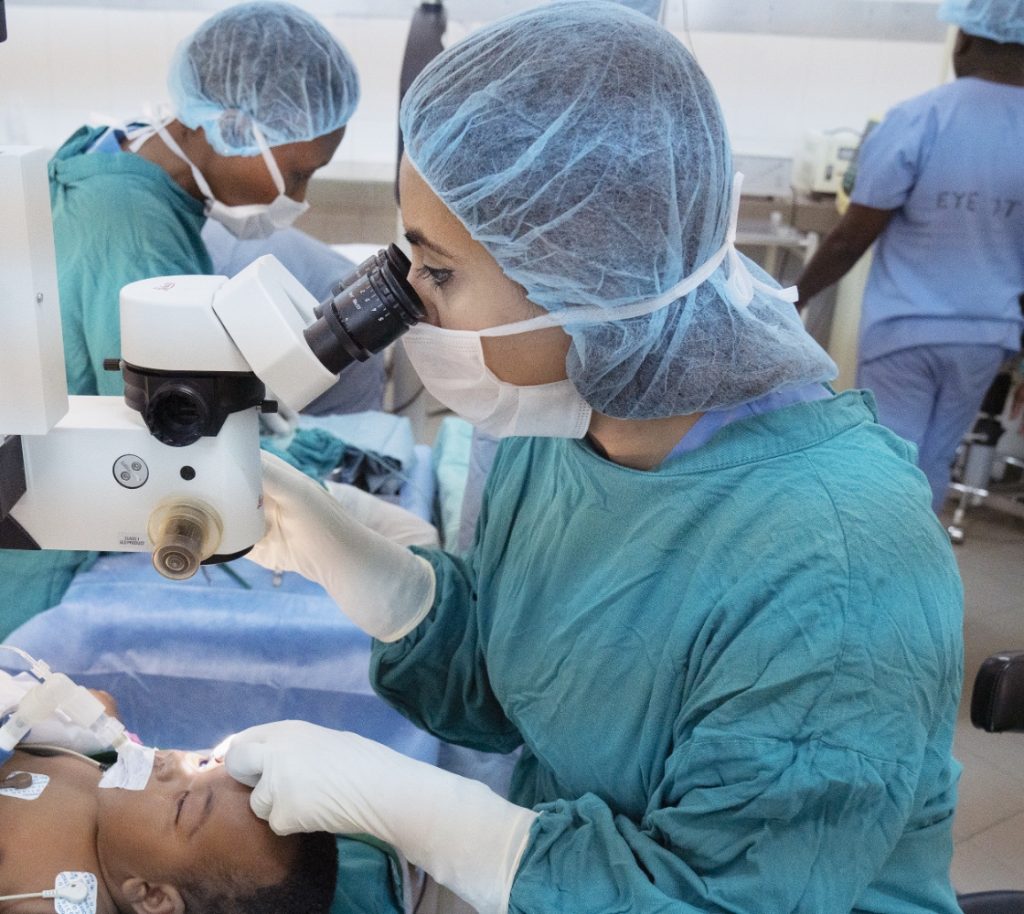 Doctor checking a child's eye