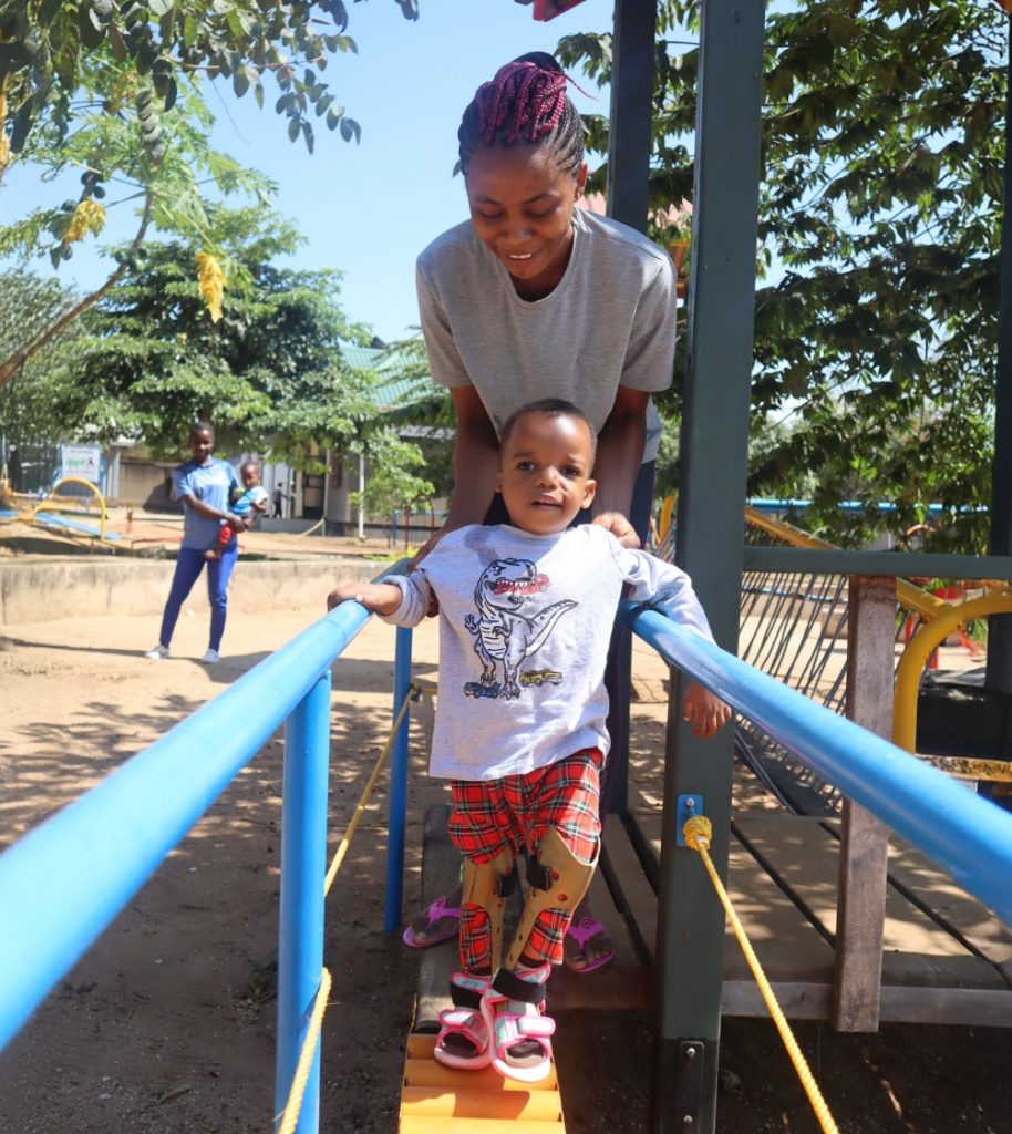 Geofrey learning to walk at House of Hope.