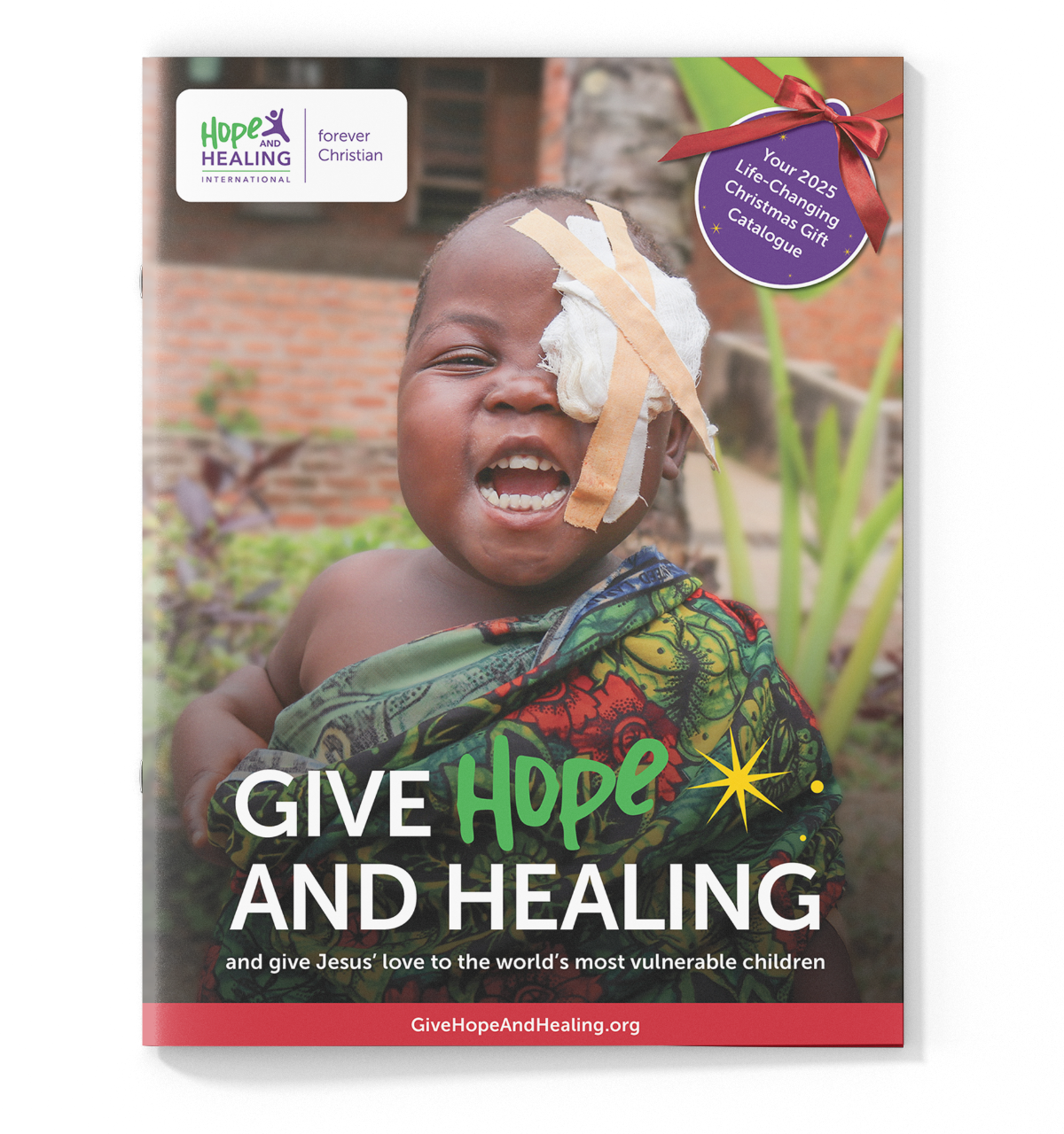 Christmas catalogue cover featuring a smiling young girl wearing an eye patch.